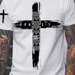May include: White t-shirt featuring a large black cross design with the word "REDEEMED" vertically and "EPH 1:7" horizontally. A small cross is on the left sleeve. The words "ONLY DIGITAL DOWNLOAD" and "INSTANT DOWNLOAD" are also visible.