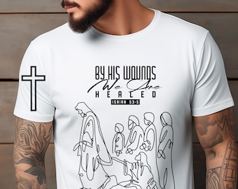 May include: White t-shirt featuring a black line art illustration of a religious scene with the text "BY HIS WOUNDS WE ARE HEALED" and a cross. The shirt also has the text "ISAIAH 53:5". The words "ONLY DIGITAL DOWNLOAD" are on the left side.