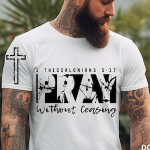 May include: A white t-shirt with a black graphic design that says "Pray Without Ceasing" with a cross and the scripture 1 Thessalonians 5:17.