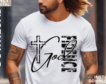 May include: A white t-shirt with a black graphic design featuring a cross and the word "God" with the word "Faith" vertically stacked on the right side. The graphic has a distressed, grunge-like effect.
