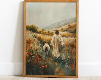 May include: A framed art print depicts a person in a cream-colored robe walking with a sheep through a field of wildflowers. The artwork has a warm color palette with shades of brown, orange, and green. The background shows rolling hills and a cloudy sky.