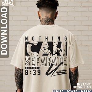 May include: A beige short-sleeve t-shirt featuring a black graphic on the back. The text reads NOTHING CAN SEPARATE US with ROMANS 8:39 below it. The design includes a distressed, ink-splatter effect and bold, stylized lettering in a block layout.