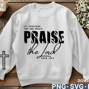 May include: White sweatshirt with black text that reads "Let everything that has breath praise the Lord Psalm 150:6". The word "praise" is in a bold, stylized font.