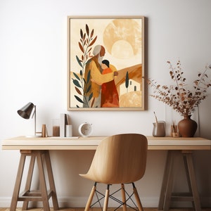Puede incluir: Una impresi&oacute;n de arte digital que presenta una ilustraci&oacute;n abstracta de dos personas abraz&aacute;ndose frente a un paisaje estilizado. El fondo incluye un sol amarillo grande y redondo y una peque&ntilde;a casa blanca. La impresi&oacute;n est&aacute; enmarcada en un marco de madera marr&oacute;n claro.