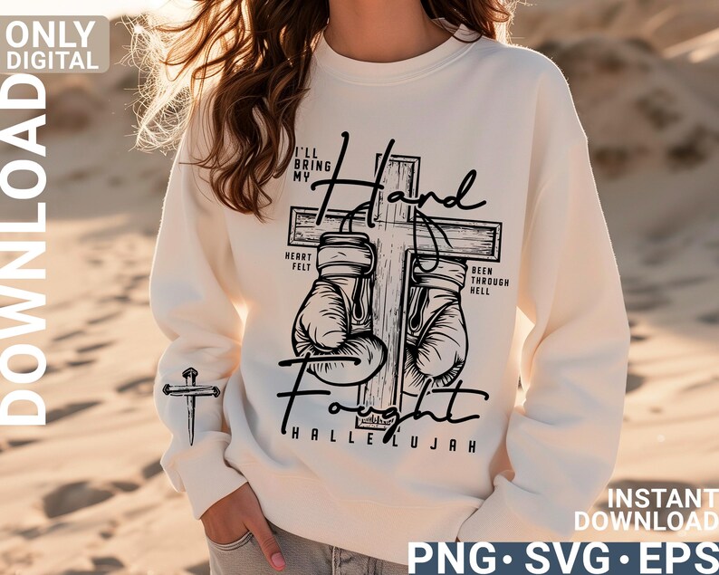 May include: Cream-colored sweatshirt with a black graphic of boxing gloves on a cross, with the words "I'll bring my hand fought hallelujah". A small cross is on the left sleeve. The words "Only Digital Download" are on the top left.