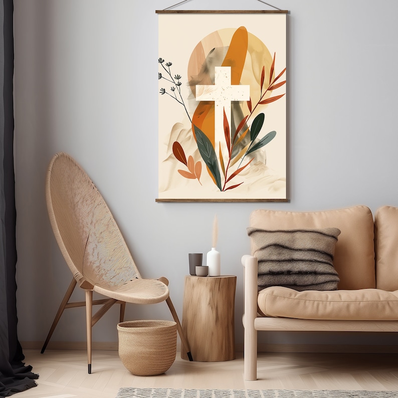 Puede incluir: Una impresi&oacute;n en lienzo beige con una cruz blanca rodeada de formas abstractas en tonos naranja, marr&oacute;n y verde. La impresi&oacute;n est&aacute; colgada en una pared gris sobre una mesa de madera y un sof&aacute; beige.