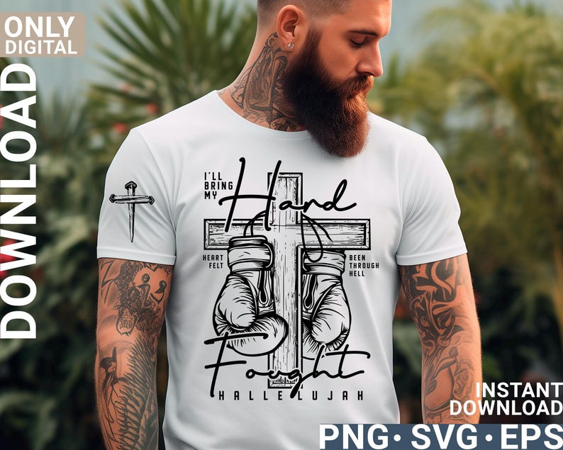 May include: White t-shirt with a graphic design featuring a cross, boxing gloves, and the words "I'll Bring My Hand Fight" and "Hallelujah". The shirt also has a small cross graphic on the sleeve.