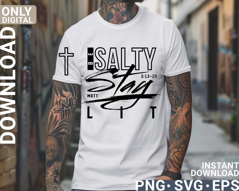 May include: White t-shirt with the text "BE SALTY Stay LIT" in black. The design includes a cross and the scripture reference "5:13-14" and "MATT". The shirt is a digital download in PNG, SVG, and EPS formats.