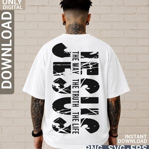 May include: A white t-shirt featuring a large black graphic on the back. The design includes the word JESUS in a distressed, bold font, with the text THE WAY THE TRUTH THE LIFE printed vertically in the center between the letters.