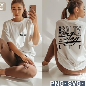May include: White t-shirt with a black cross graphic on the front and the words "Be Salty Stay Lit" on the back. The shirt is paired with brown pants. The image also includes the text "ONLY DIGITAL DOWNLOAD" and "INSTANT DOWNLOAD PNG SVG EPS".