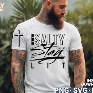 May include: White t-shirt with a black cross and the words "BE SALTY Stay LIT" in a stylized font. The text also includes "MATT 5:13-14". The shirt is a digital download in PNG, SVG, and EPS formats.