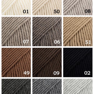 May include: A color chart of yarn samples in various shades of white, beige, brown, and gray. The samples are numbered 01 through 51.
