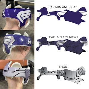 May include: Three helmet designs featuring superhero characters. The first two designs are for Captain America, one with a solid blue background and the other with a distressed blue background. The third design is for Thor and features a silver and black design.