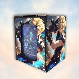 May include: A square deck box featuring a graphic print of a spiky-haired character with a large sword. The front panel has a rectangular cutout displaying a game card with blue and dark imagery. The design includes vibrant blue light effects.