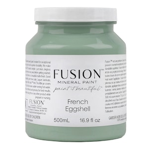 May include: A 500ml bottle of Fusion Mineral Paint in the colour French Eggshell. The paint is a light green colour and the bottle has a white label with the Fusion logo and the paint colour name. The label also includes the text "paint it beautiful".