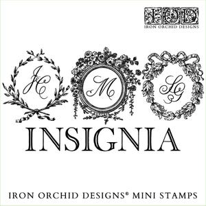 May include: Three black and white mini stamps with ornate frames and initials "JC", "M", and "LG". The stamps are arranged horizontally and are labelled "INSIGNIA" below. The text "IRON ORCHID DESIGNS® MINI STAMPS" is at the bottom of the image.