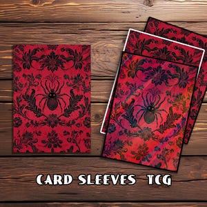 May include: Red card sleeves with a black spider and floral design. The text "CARD SLEEVES TCG" is at the bottom. The sleeves are on a wooden surface.