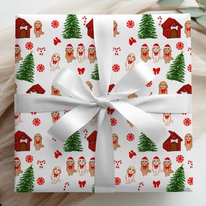 May include: A wrapped gift with a white bow. The wrapping paper features a repeating pattern of brown dogs wearing Santa hats, red dog houses, green Christmas trees, and red and white candy canes on a white background.