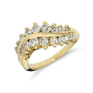 May include: A gold band ring with a curved design featuring a row of small, clear diamonds.