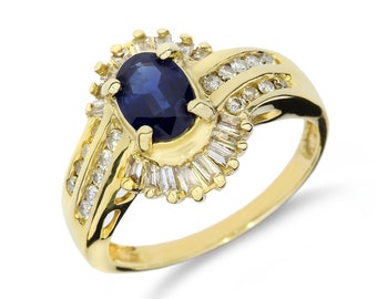 May include: A gold ring with a large oval blue sapphire surrounded by a halo of smaller diamonds. The band is also set with diamonds.