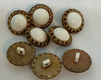 Eight White and Gold Tone Buttons