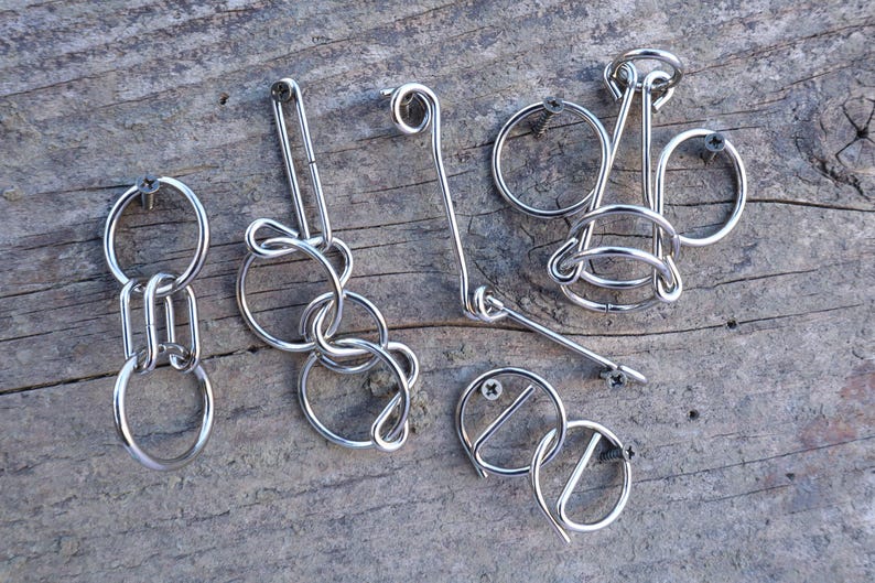 Hanayama Wire Puzzle Set - Orange contains 5 mini wire puzzles. IQ Logic, Brain Teaser, Puzzle Master. image 1