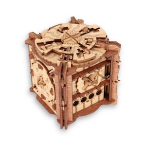 May include: A wooden puzzle box with intricate carvings and a complex locking mechanism. The box is made of light and dark wood and has a square shape.