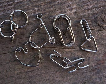 Hanayama Wire Puzzle Set - Green contains 5 mini wire puzzles. IQ Logic, Brain Teasers, Puzzle Master.