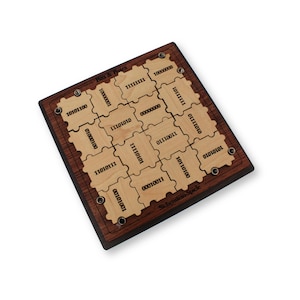 May include: A wooden puzzle game with a dark brown frame and light brown puzzle pieces. The pieces are engraved with binary numbers. The game is labeled "Bits & Bytes" and "Schesten-Spiele".