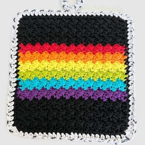 May include: A square, handmade crochet potholder with a black background and a rainbow stripe design. The rainbow stripes include red, orange, yellow, green, blue, and purple. The potholder has a white and black border and a loop for hanging.
