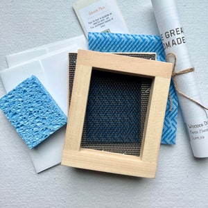 The 3x4" mould and deckle, sponge, envelopes and card stock, instruction book, and gold mica.