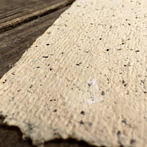 Rustic handmade stationary with brown flecks.