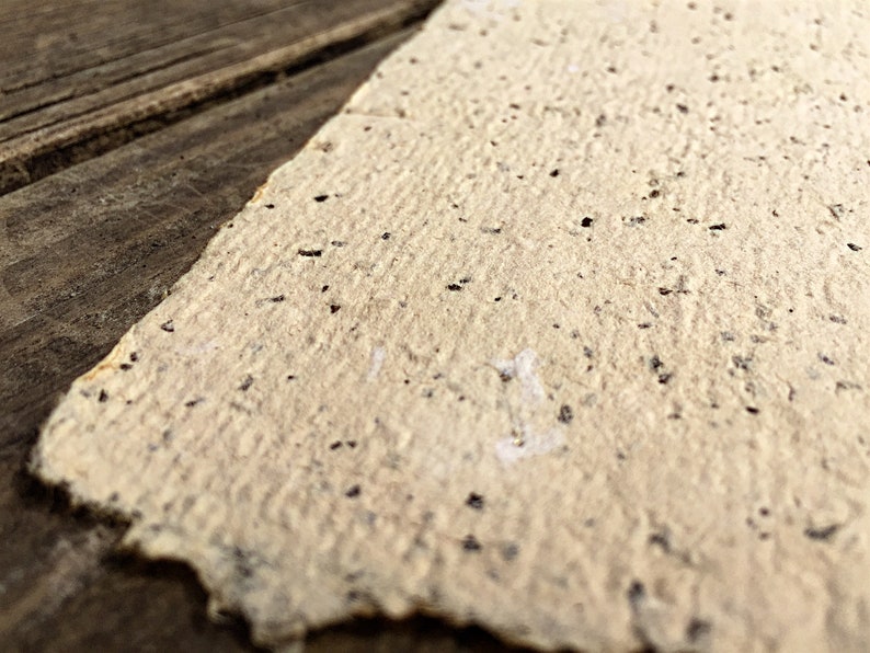 Rustic handmade stationary with brown flecks.