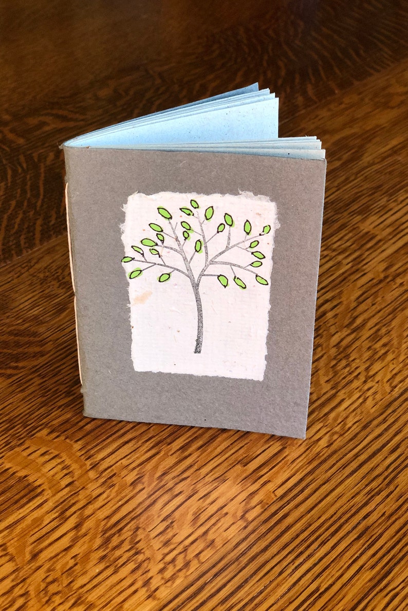 A handbound journal with 3x4" handmade paper.