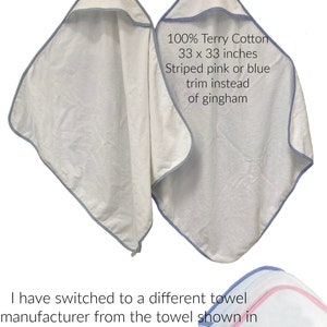 May include: White hooded towel made of 100% Terry Cotton, measuring 33 x 33 inches. The towel has a blue trim. The new version features a striped pink or blue trim instead of gingham.