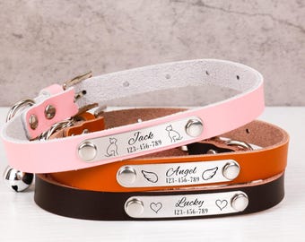May include: Three leather pet collars with personalised engraved tags. The pink collar has a cat icon and the name "Jack" with a phone number. The brown collar has a wing icon and the name "Angel" with a phone number. The black collar has a heart icon and the name "Lucky" with a phone number.