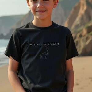 Kids Organic Cotton T-shirt: German Humor - Life Is No Pony Farm
