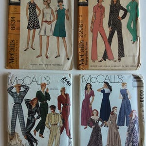 May include: Four vintage McCall's sewing pattern envelopes featuring illustrations of various dresses and jumpsuits. The envelopes display model sketches, pattern numbers 8834, 2296, 2140, and 6688, along with text detailing garment styles and sizing.