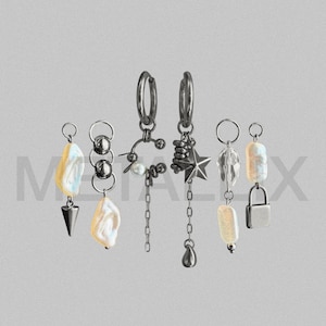 May include: A set of six silver-toned earrings featuring various charms including irregular white pearls, a metal star, a small padlock, a teardrop, and a cone shape. The earrings are arranged in a row against a light gray background with the text METALLEX.