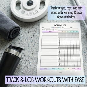 May include: A workout log with space to track exercises, sets, reps, and weight. The text "Track & Log Workouts With Ease" is at the bottom. A 20.4 kg weight, a rolled-up towel, and a black shaker bottle are also in the image.