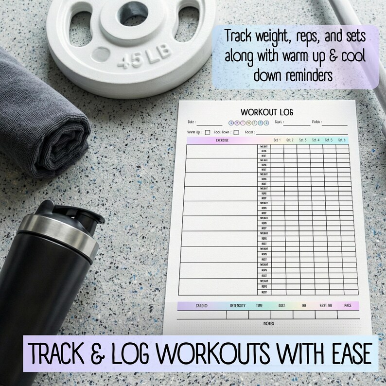 May include: A workout log with space to track exercises, sets, reps, and weight. The text "Track & Log Workouts With Ease" is at the bottom. A 20.4 kg weight, a rolled-up towel, and a black shaker bottle are also in the image.