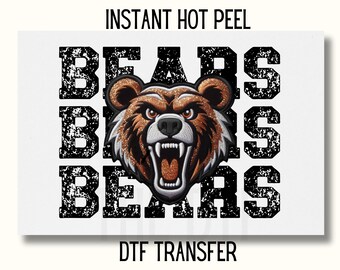 May include: A white background with the words "BEARS" in black with a distressed look. A brown and orange bear head with a fierce expression is in the center of the words. The words "INSTANT HOT PEEL" and "DTF TRANSFER" are also on the image.