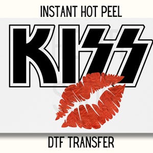 May include: Instant hot peel DTF transfer with the word "KISS" in black with a white outline and a red lip print below.