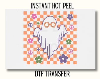May include: A white ghost with pink sunglasses on a checkered orange and white background with peace signs and flowers. The text "INSTANT HOT PEEL" and "DTF TRANSFER" are also included.