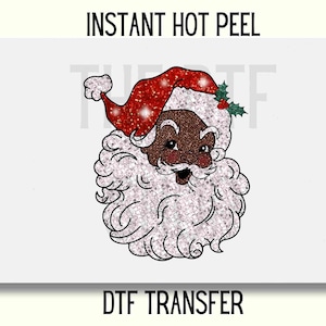 May include: A digital transfer design featuring a cartoon Santa Claus with a red hat and white beard. The Santa Claus has brown skin and is smiling. The design is perfect for creating custom apparel, home decor, and other crafts.