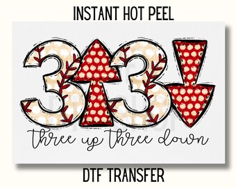 May include: A red and white polka dot design with the numbers 33 and arrows pointing up and down. The text "three up three down" is below the numbers.  The design is on a white background with the text "INSTANT HOT PEEL DTF TRANSFER" at the top.