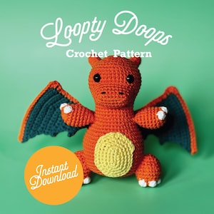 May include: A crocheted orange and yellow dragon with teal wings. The dragon is sitting on a green background. The text "Loopy Doops Crochet Pattern" is above the dragon. The text "Instant Download" is in a circle below the dragon.