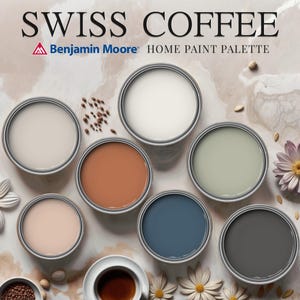May include: A paint color palette called "Swiss Coffee" by Benjamin Moore. The palette features eight paint colors in small paint cans, arranged in a circle on a light brown marble surface. The colors are: white, light brown, light pink, light green, dark blue, dark gray, and cream.