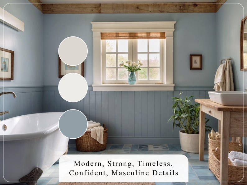 May include: Bathroom interior design featuring a freestanding white bathtub, light blue walls, and white wainscoting.  A wooden vanity with a vessel sink and beige and blue color palettes are shown. The text 'Modern, Strong, Timeless, Confident, Masculine Details' is displayed below the image.