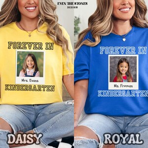 May include: Yellow and blue t-shirts with the text "FOREVER IN KINDERGARTEN" and a photo of a young girl. The yellow shirt says "Mrs. Evans" and the blue shirt says "Ms. Froman". The word "DAISY" is below the yellow shirt and "ROYAL" is below the blue shirt.